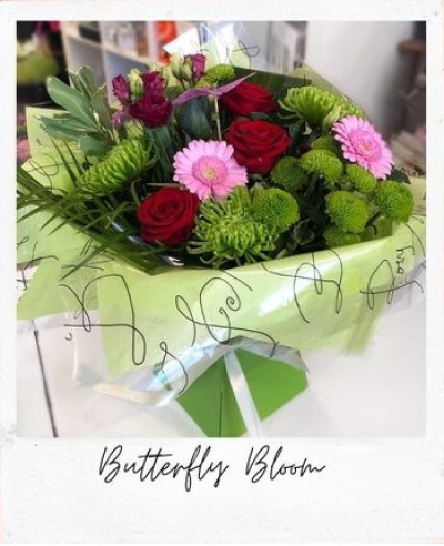 Butterfly Bloom - Handtied in water. Pinks reds and greens to include red roses