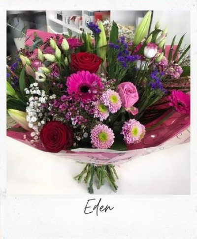 Eden - Handtied of mixed seasonal flowers in reds, pinks and purples